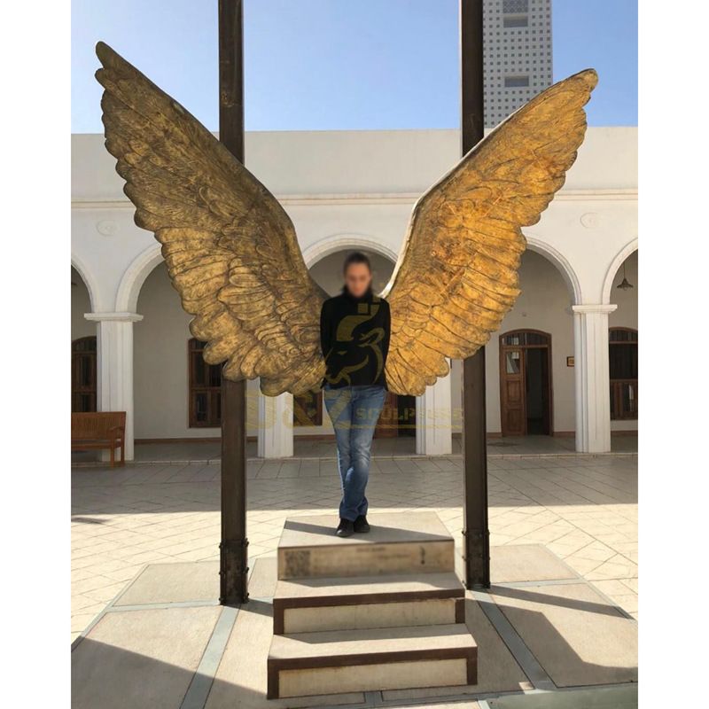 Large Squares Are Decorated With Bronze Angel Wing Sculptures