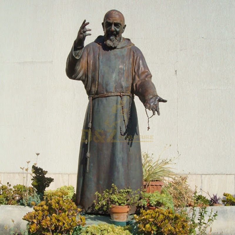 Bronze Statue Of St Padre Pio Stands In The Garden