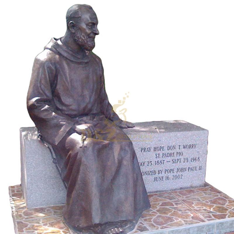 Outdoor Decorated With A Seated Bronze Statue Of St Padre Pio