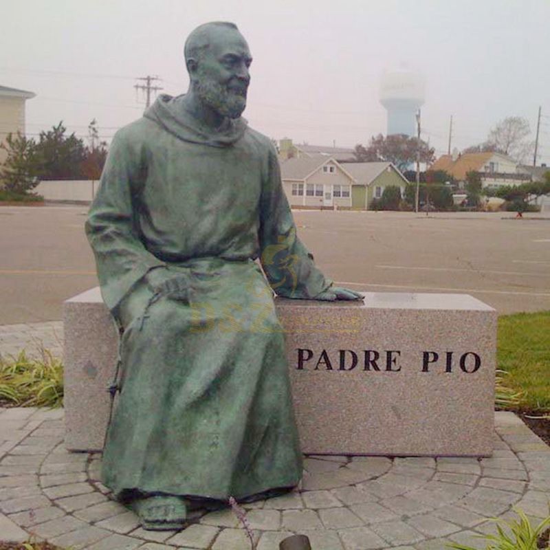 Outdoor Decorated With A Seated Bronze Statue Of St Padre Pio