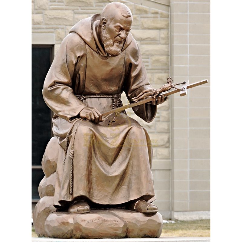 Outdoor Decorated With A Seated Bronze Statue Of St Padre Pio