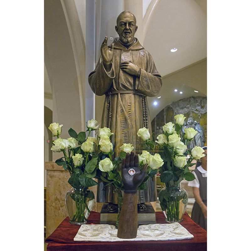 Bronze Statue Of St Padre Pio Stands In The Garden