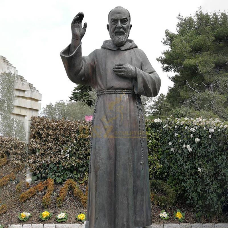 Bronze Statue Of St Padre Pio Stands In The Garden