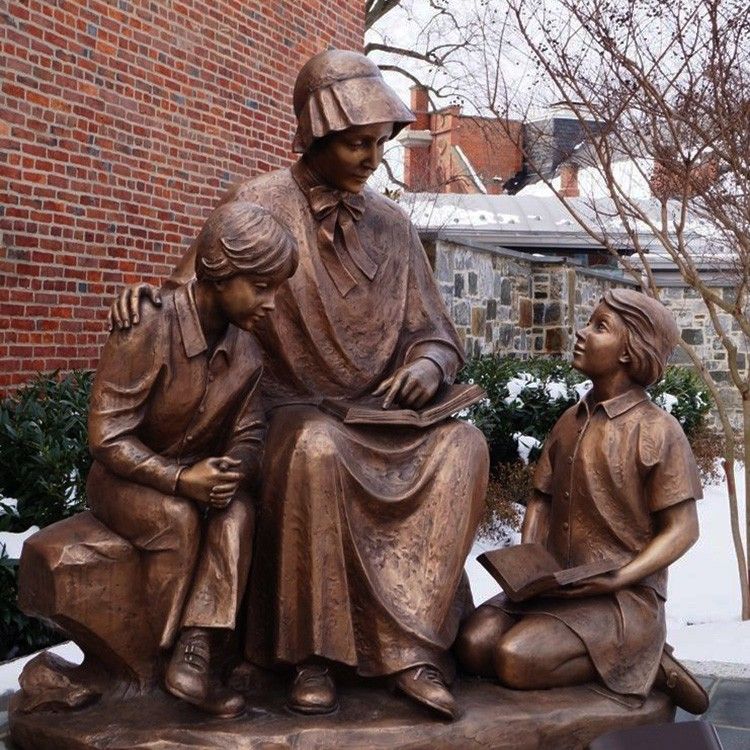 saint statue holding a book