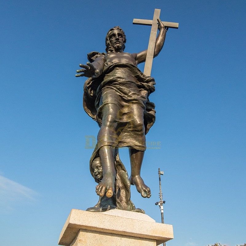 Famous outdoor bronze statue of Jesus holding a cross for sale