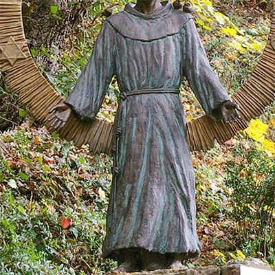 st. francis of assisi statue with dog