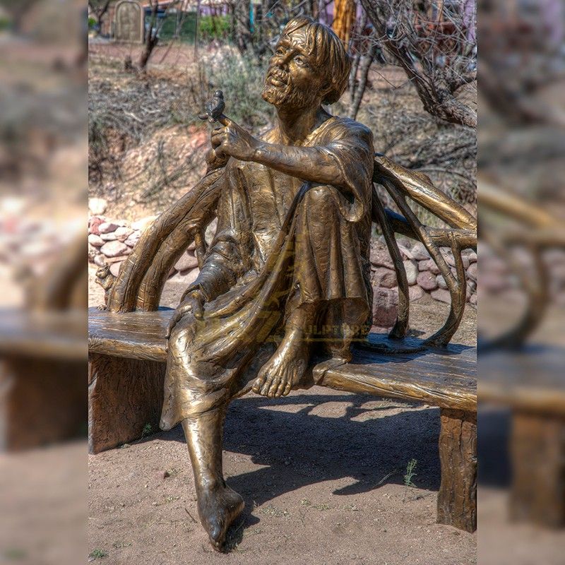 Bronze statue of st francis in assisi and bird sitting on a chair for sale