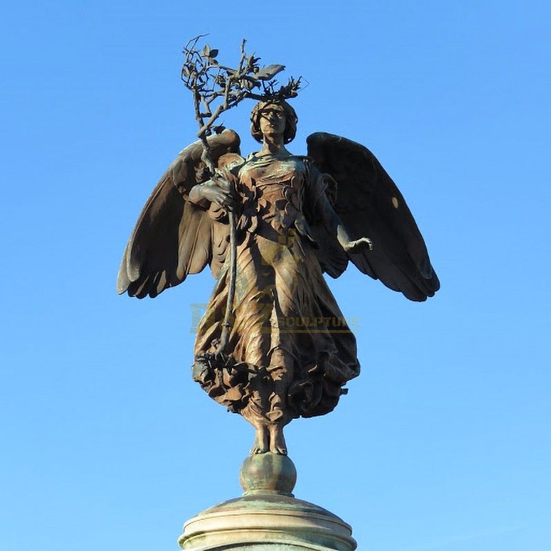 Large angel statue standing on a ball holding a tree branch for sale