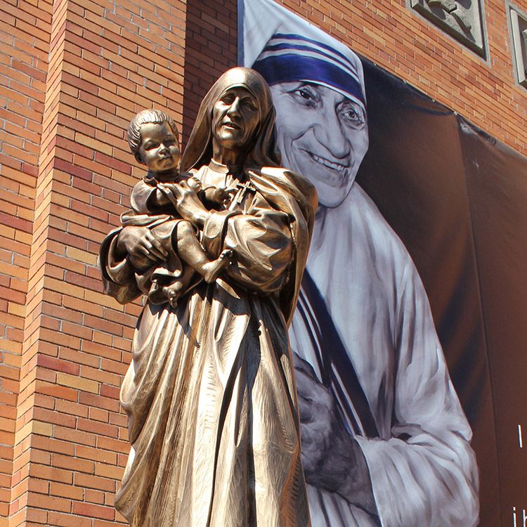The gracious bronze religious saint Teresa statue