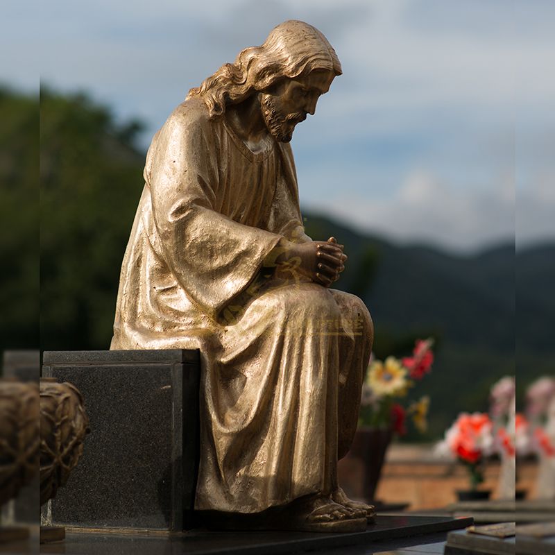 jesus statue on park bench