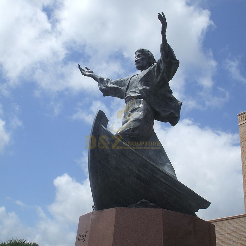 Life-size bronze statue of Jesus standing on a boat with open hands