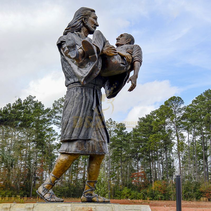 jesus carrying a man statue